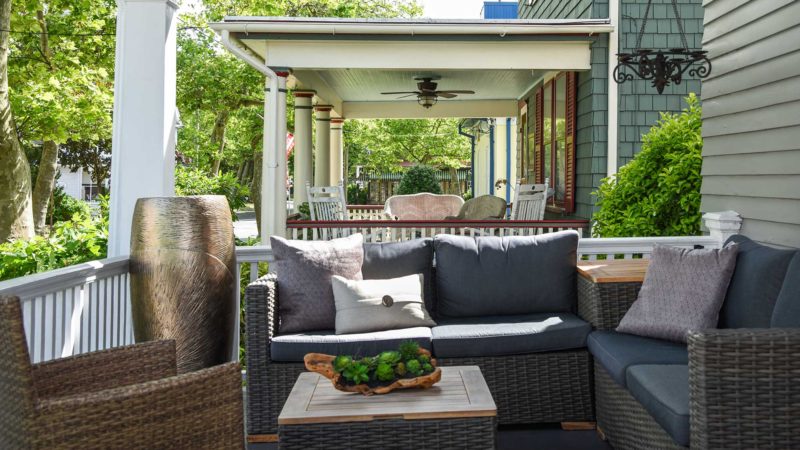 Outdoor furniture on a covered porch